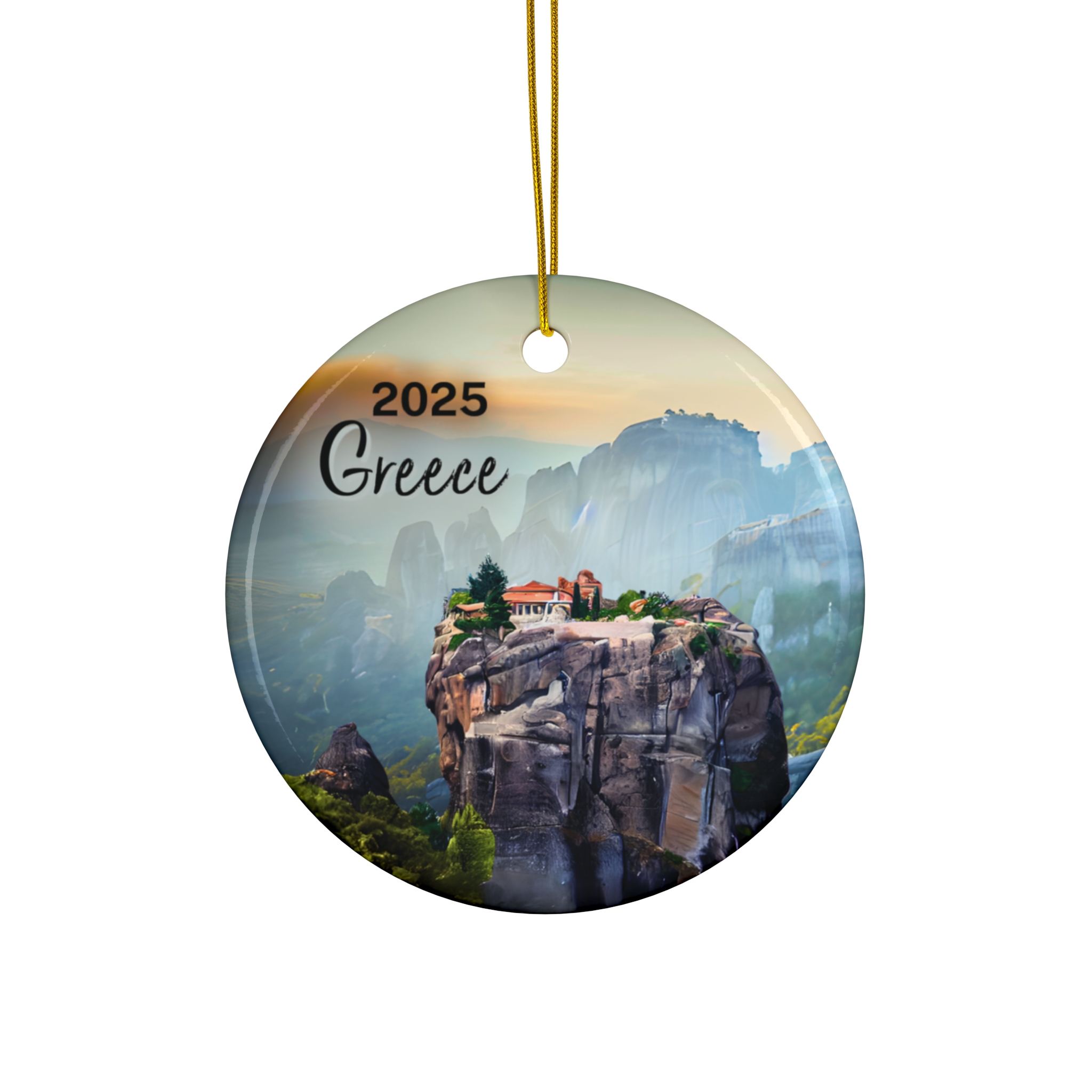 Round ornament with a golden string, featuring a scenic view of Meteora Greece monasteries, misty mountains in the background, and the text 2025 Year Greece at the top left.
